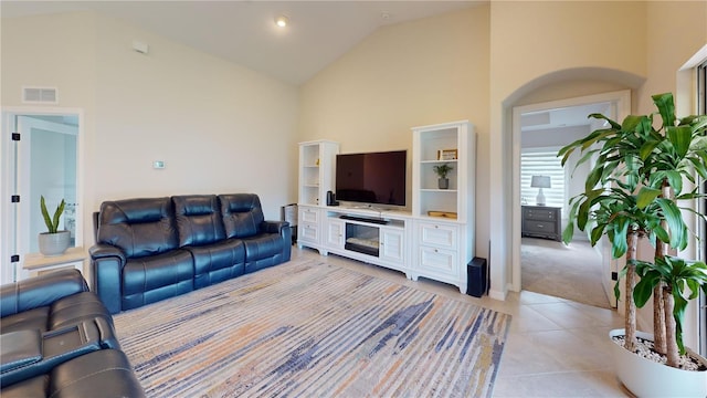 90 Randolph Dr, Palm Coast, FL 32164 - living area with high vaulted ceiling and light tile patterned flooring