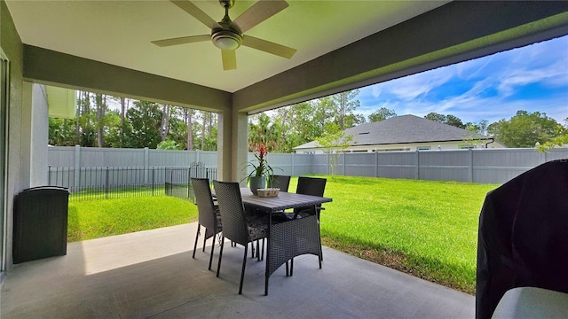 90 Randolph Dr, Palm Coast, FL 32164 - fenced backyard with a patio area, outdoor dining area, a ceiling fan, and grilling area
