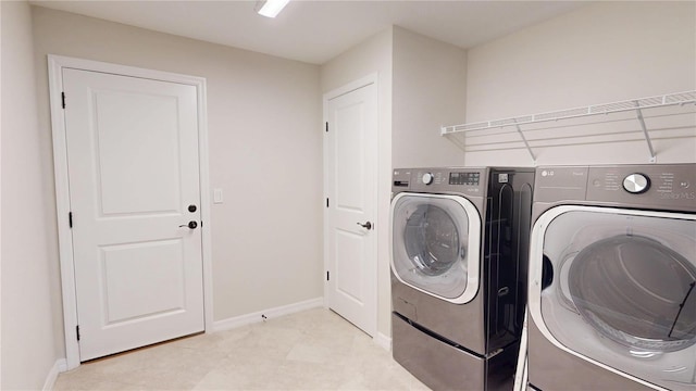 90 Randolph Dr, Palm Coast, FL 32164 - laundry room featuring independent washer and dryer and baseboards