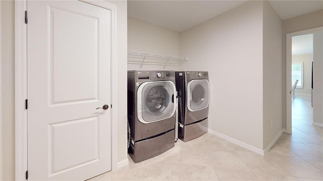90 Randolph Dr, Palm Coast, FL 32164 - laundry room with washing machine and dryer and light tile patterned flooring