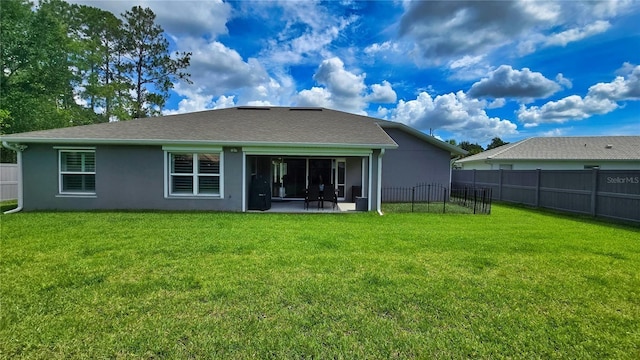 90 Randolph Dr, Palm Coast, FL 32164 - back of property featuring a fenced backyard, stucco siding, and a patio