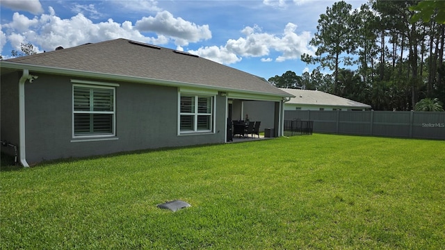 90 Randolph Dr, Palm Coast, FL 32164 - rear view of house with a patio area and a shingled roof
