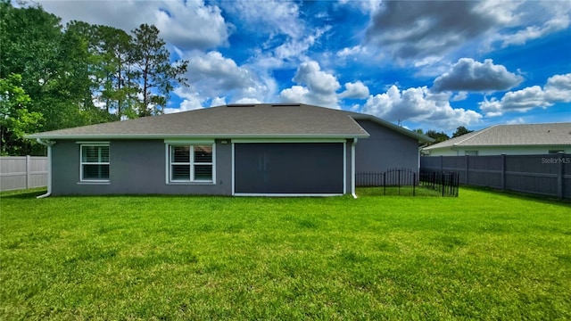 90 Randolph Dr, Palm Coast, FL 32164 - back of property featuring a fenced backyard and stucco siding