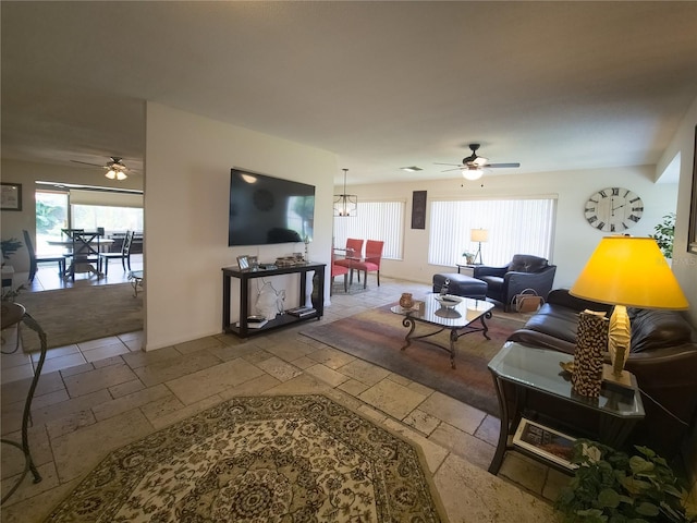 9 Collins Ln, Palm Coast, FL 32137 - living area with a ceiling fan and stone tile flooring