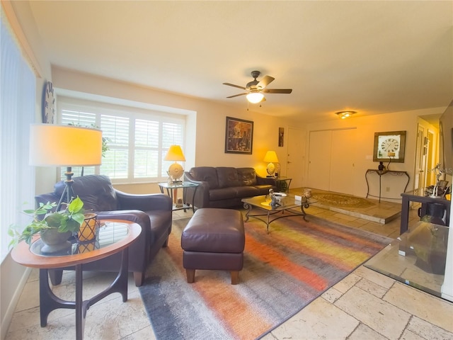 9 Collins Ln, Palm Coast, FL 32137 - living room with ceiling fan and stone tile floors
