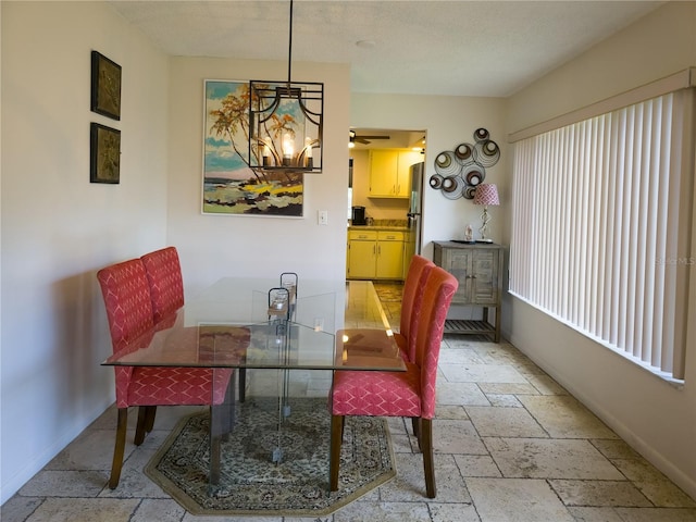 9 Collins Ln, Palm Coast, FL 32137 - dining room with stone tile flooring and ceiling fan