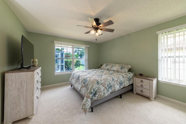 4 Essington Ln, Palm Coast, FL 32164 - bedroom with a textured ceiling, light colored carpet, and ceiling fan