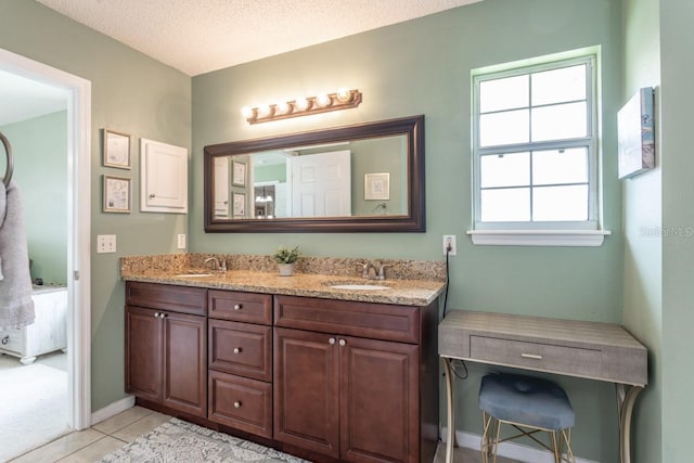 4 Essington Ln, Palm Coast, FL 32164 - full bath featuring double vanity, tile patterned floors, and a textured ceiling