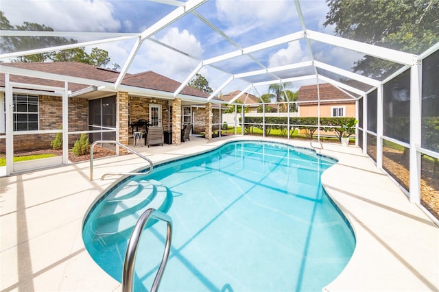 4 Essington Ln, Palm Coast, FL 32164 - view of swimming pool with a patio and glass enclosure