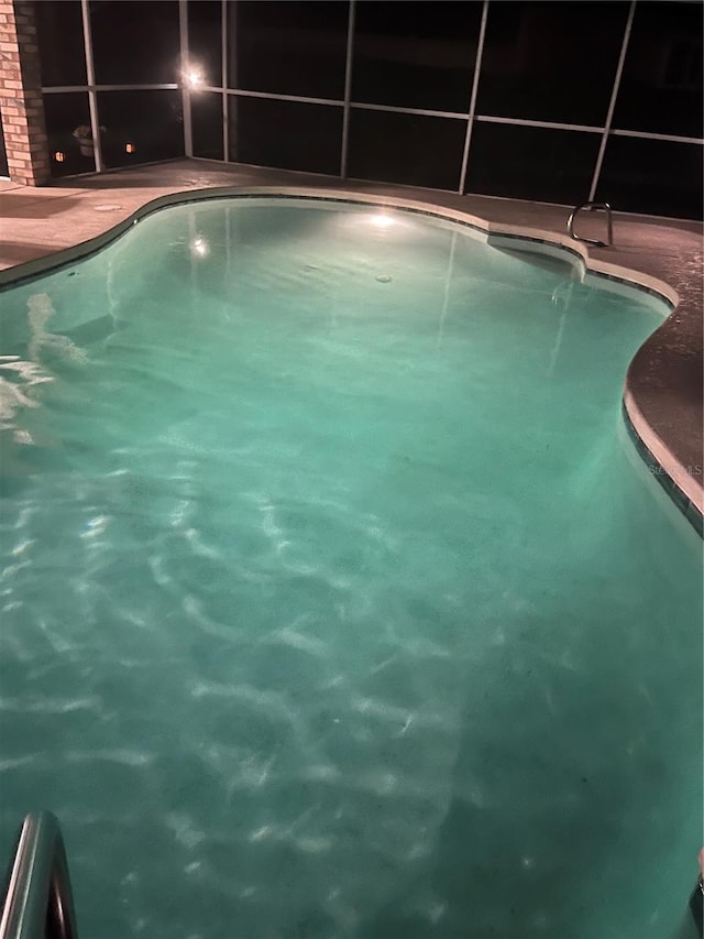 4 Essington Ln, Palm Coast, FL 32164 - outdoor pool featuring a lanai and a patio