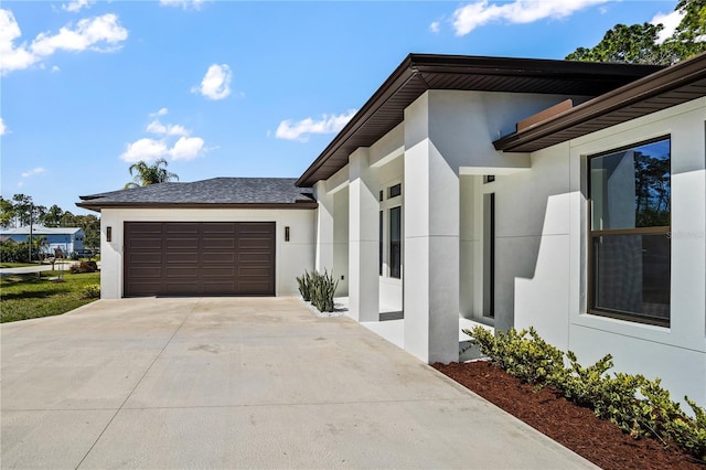 179 Eric Dr, Palm Coast, FL 32164 - view of side of property with stucco siding, an attached garage, and driveway