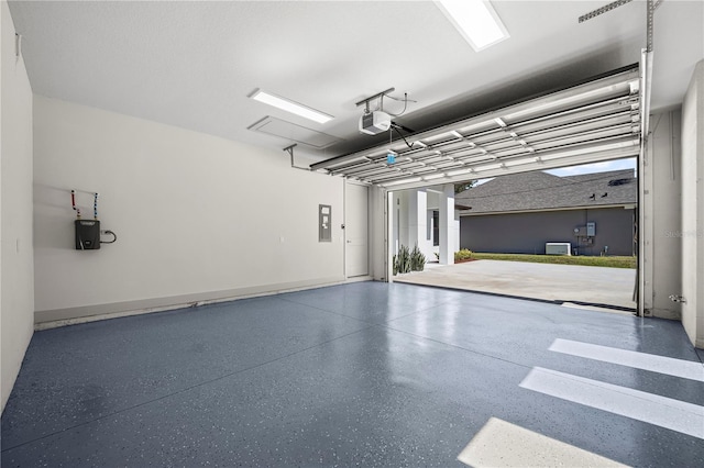 179 Eric Dr, Palm Coast, FL 32164 - garage with a garage door opener and electric panel