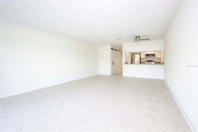 3630 S Central Ave, Flagler Beach, FL 32136 - unfurnished living room featuring ceiling fan and light tile patterned floors