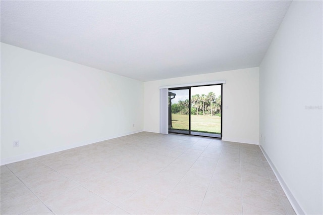 3630 S Central Ave, Flagler Beach, FL 32136 - empty room with light tile patterned floors