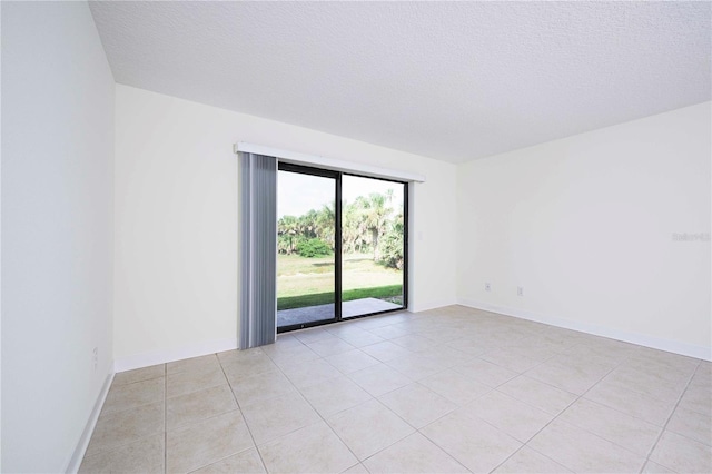 3630 S Central Ave, Flagler Beach, FL 32136 - spare room with light tile patterned floors and a textured ceiling