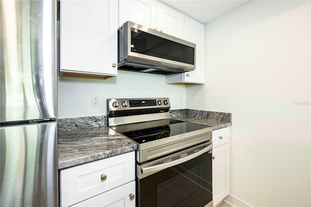 3630 S Central Ave, Flagler Beach, FL 32136 - kitchen featuring appliances with stainless steel finishes and white cabinetry
