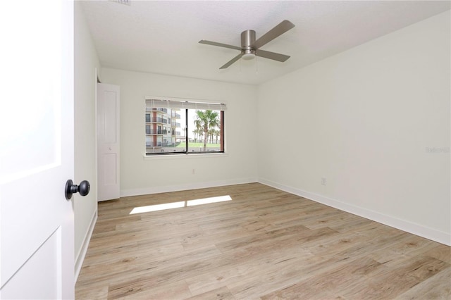 3630 S Central Ave, Flagler Beach, FL 32136 - unfurnished room with light wood-style floors and a ceiling fan