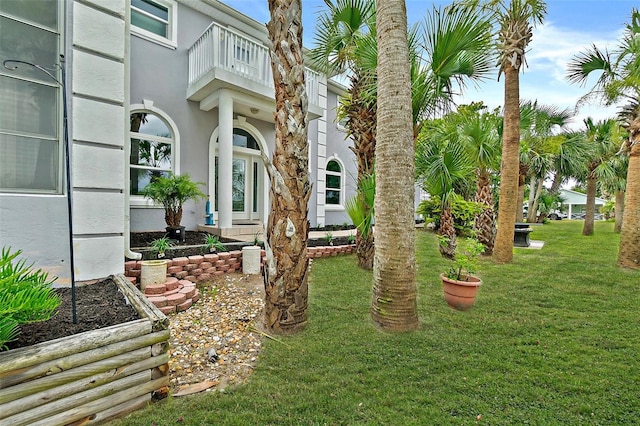 101 N 22nd St, Flagler Beach, FL 32136 - view of green lawn with a balcony