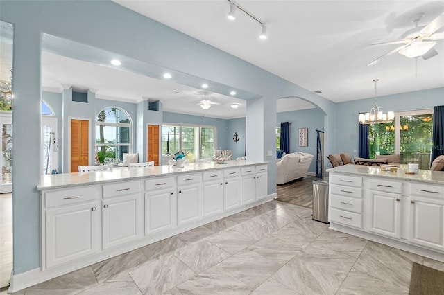 101 N 22nd St, Flagler Beach, FL 32136 - bathroom with ceiling fan, connected bathroom, a chandelier, vanity, and vaulted ceiling