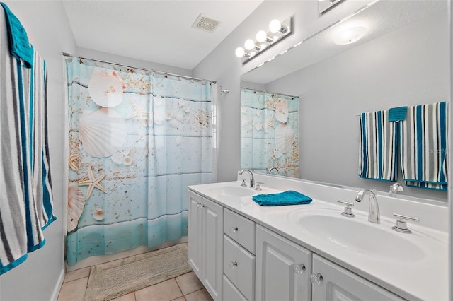 101 N 22nd St, Flagler Beach, FL 32136 - bathroom with double vanity and tile patterned flooring