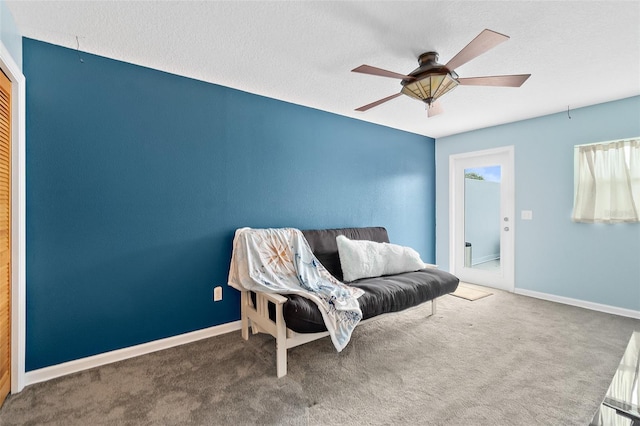 101 N 22nd St, Flagler Beach, FL 32136 - living area with carpet flooring, a ceiling fan, and a textured ceiling
