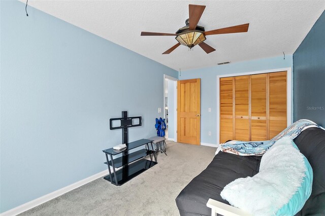 101 N 22nd St, Flagler Beach, FL 32136 - sitting room with ceiling fan, carpet floors, and a textured ceiling