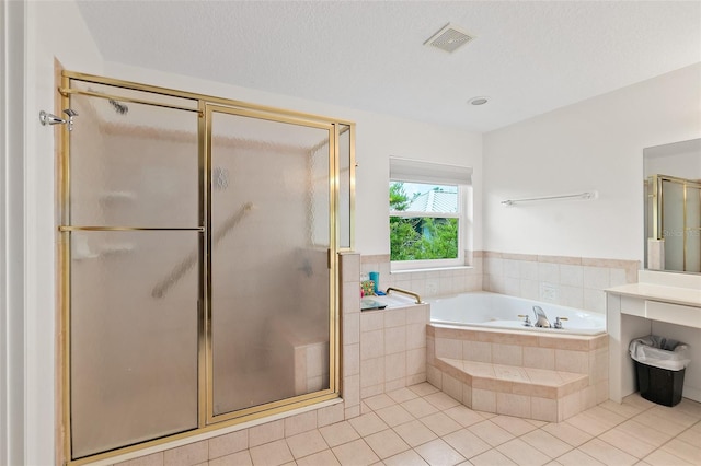 101 N 22nd St, Flagler Beach, FL 32136 - full bathroom featuring tile patterned floors, a garden tub, a shower stall, and vanity