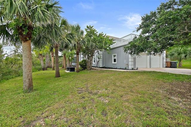 101 N 22nd St, Flagler Beach, FL 32136 - view of green lawn featuring concrete driveway and a garage