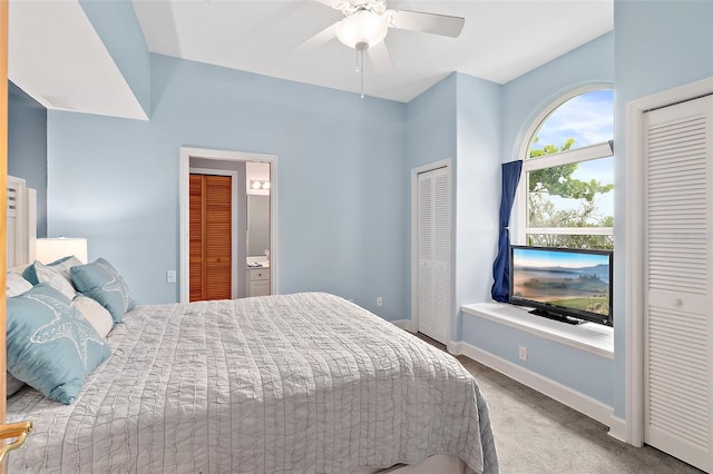 101 N 22nd St, Flagler Beach, FL 32136 - carpeted bedroom featuring two closets, ceiling fan, and connected bathroom