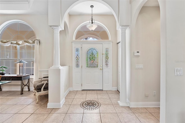 68 Egret Trl, Palm Coast, FL 32164 - foyer entrance featuring ornate columns and tile patterned floors