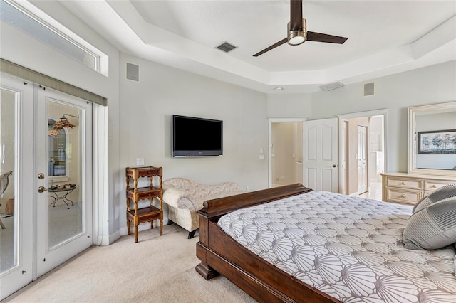 68 Egret Trl, Palm Coast, FL 32164 - bedroom with light colored carpet, access to outside, connected bathroom, and ceiling fan