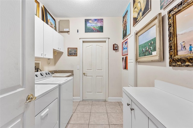 68 Egret Trl, Palm Coast, FL 32164 - laundry room with cabinet space, separate washer and dryer, light tile patterned floors, and a textured ceiling
