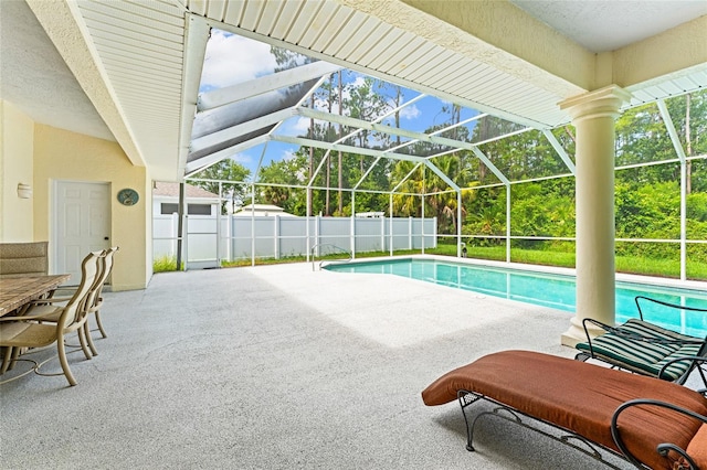 68 Egret Trl, Palm Coast, FL 32164 - view of swimming pool with a patio and glass enclosure
