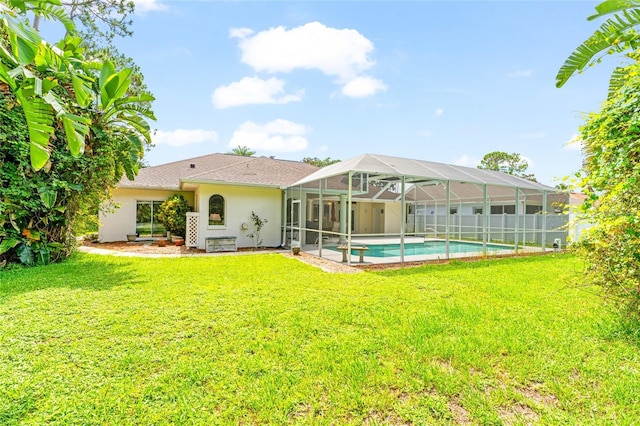 68 Egret Trl, Palm Coast, FL 32164 - back of house with stucco siding and glass enclosure
