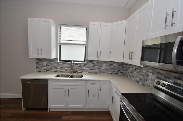 77 Green Cir, Palm Coast, FL 32164 - kitchen featuring stainless steel appliances, dark wood-style floors, and tasteful backsplash