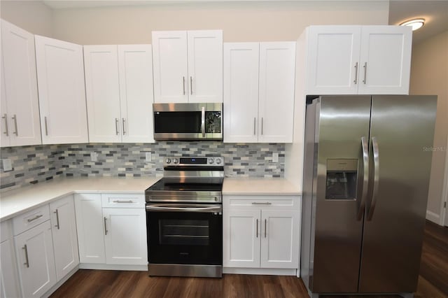 77 Green Cir, Palm Coast, FL 32164 - kitchen with appliances with stainless steel finishes, light countertops, and white cabinets