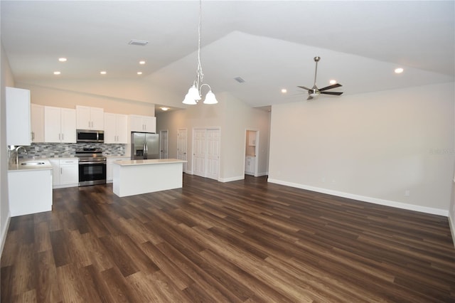 77 Green Cir, Palm Coast, FL 32164 - kitchen with appliances with stainless steel finishes, open floor plan, a kitchen island, a chandelier, and light countertops