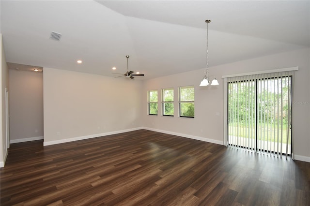 77 Green Cir, Palm Coast, FL 32164 - empty room featuring lofted ceiling, a chandelier, a ceiling fan, dark wood-style flooring, and recessed lighting