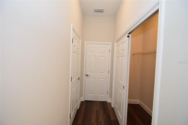 77 Green Cir, Palm Coast, FL 32164 - corridor featuring dark wood-style floors and baseboards