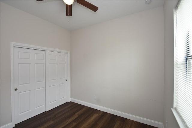 77 Green Cir, Palm Coast, FL 32164 - unfurnished bedroom featuring dark wood finished floors, a closet, and ceiling fan