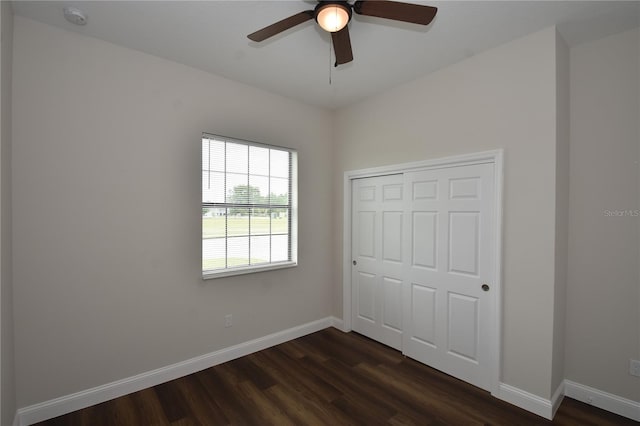 77 Green Cir, Palm Coast, FL 32164 - unfurnished bedroom with dark wood-style flooring, a closet, and ceiling fan