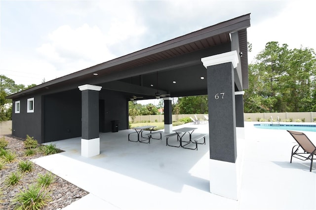 77 Green Cir, Palm Coast, FL 32164 - view of home's community featuring a patio area and a swimming pool