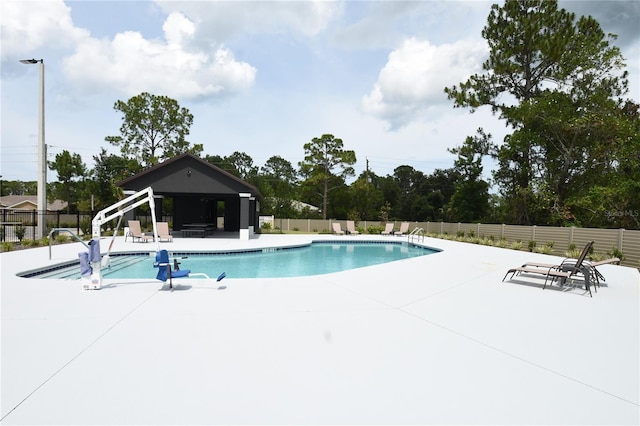 77 Green Cir, Palm Coast, FL 32164 - community pool with a patio area