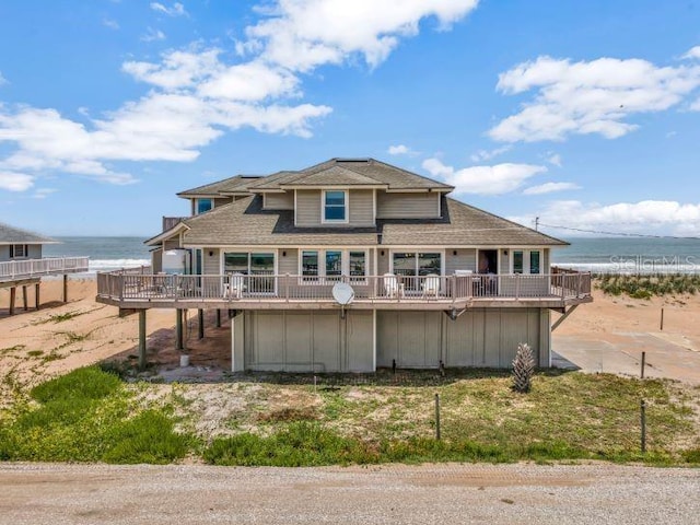 9353 Old A1A, Saint Augustine, FL 32080 - rear view of property featuring a deck with water view, a pool, and roof with shingles