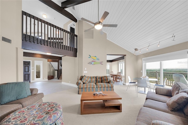 9353 Old A1A, Saint Augustine, FL 32080 - carpeted living area with high vaulted ceiling, ceiling fan, stairs, and track lighting