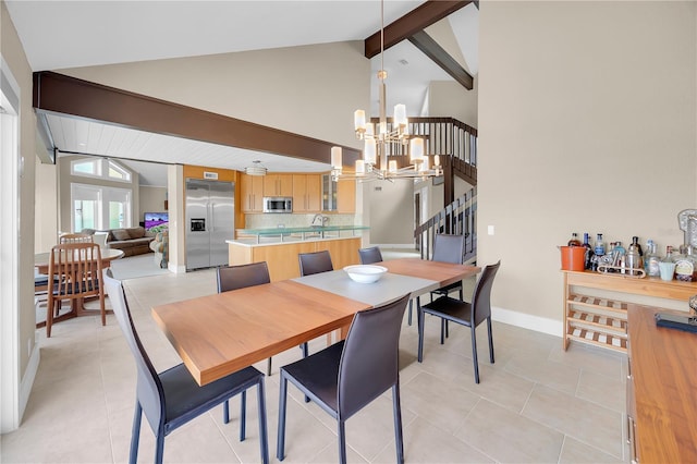 9353 Old A1A, Saint Augustine, FL 32080 - dining area featuring a chandelier, beamed ceiling, stairs, high vaulted ceiling, and light tile patterned flooring