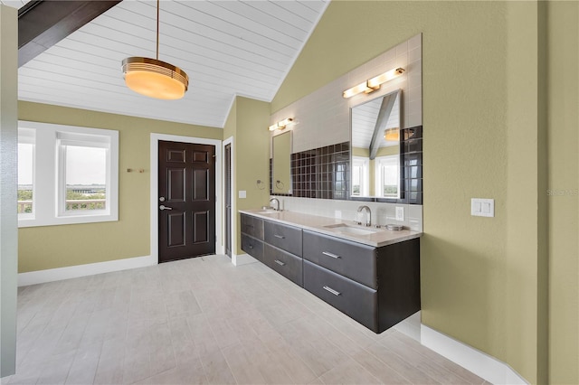 9353 Old A1A, Saint Augustine, FL 32080 - bathroom with double vanity, lofted ceiling, and wooden ceiling