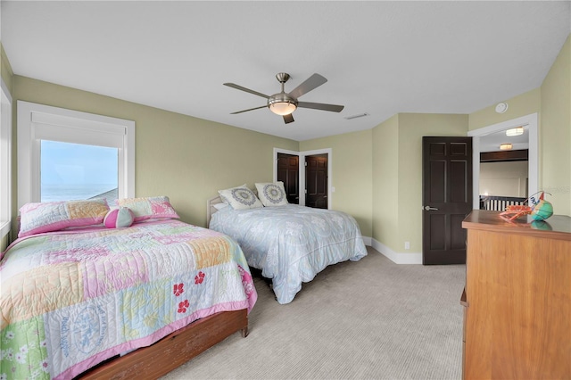 9353 Old A1A, Saint Augustine, FL 32080 - bedroom featuring light carpet and a ceiling fan