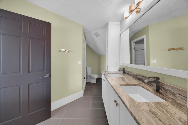 9353 Old A1A, Saint Augustine, FL 32080 - full bathroom with double vanity, tile patterned floors, and a textured ceiling