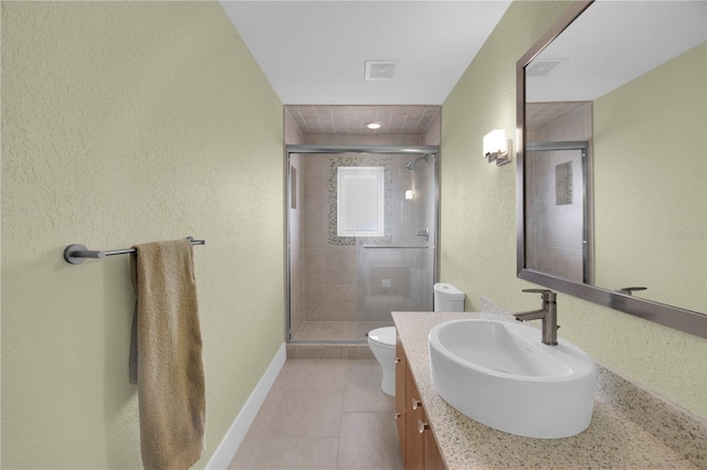 9353 Old A1A, Saint Augustine, FL 32080 - full bathroom with vanity, a stall shower, tile patterned flooring, and a textured wall